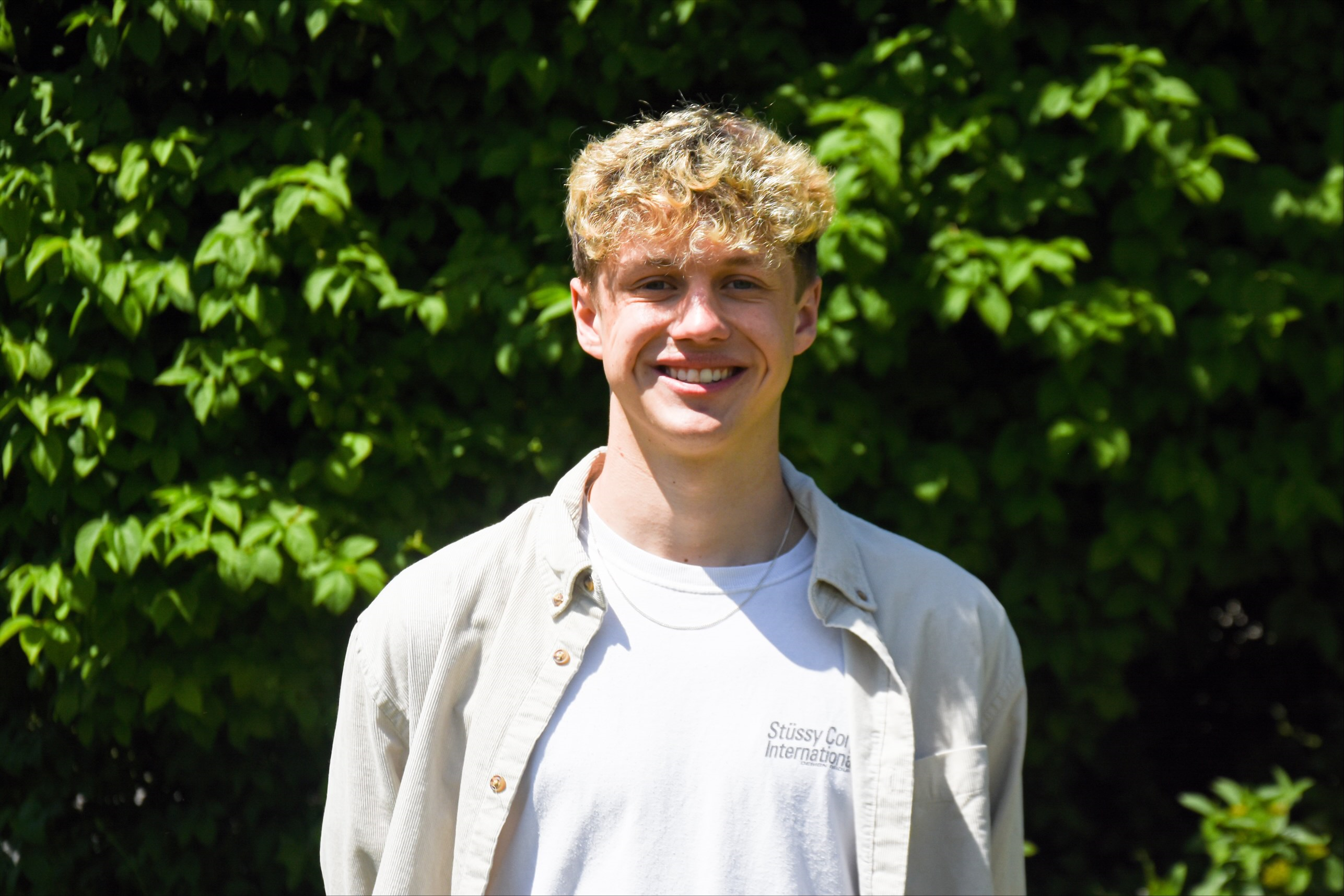 University of Worcester logo on a light blue background