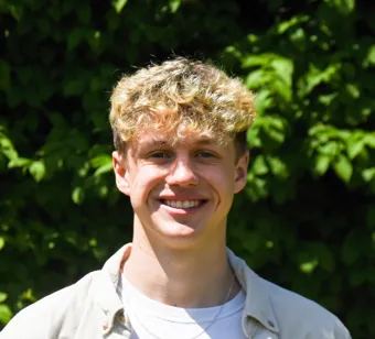 University of Worcester logo on a light blue background