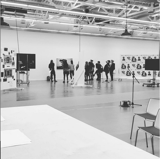 students gathered in an art gallery