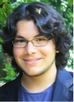 young man with black hair and glasses
