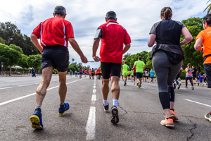 Blind Runner with Sighted runner taking part in a marathon
