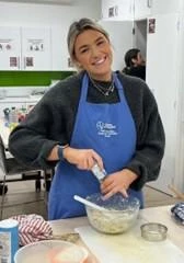 University of Worcester logo on a light blue background