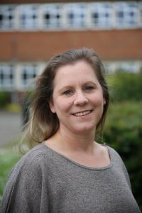 University of Worcester logo on a light blue background