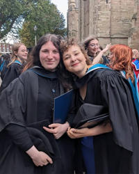 Creative Writing prize winners in graduation gowns
