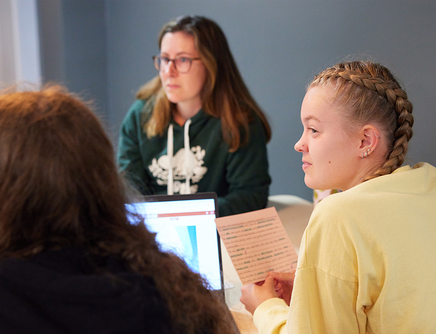 Students working together on a writing piece