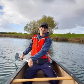 University of Worcester logo on a light blue background