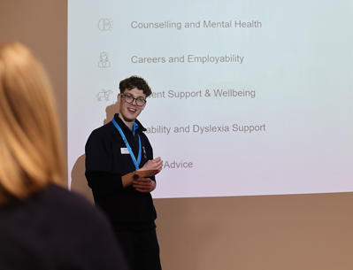 Man giving a presentation about university
