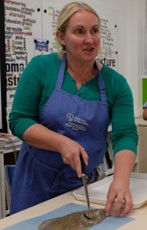 University of Worcester logo on a light blue background