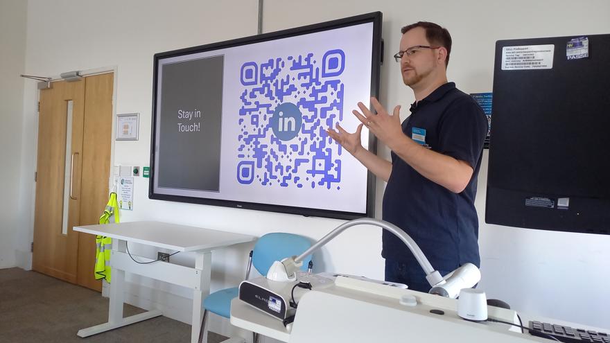 A speaker delivering a presentation