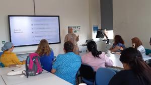 A speaker delivering a talk to a room of people