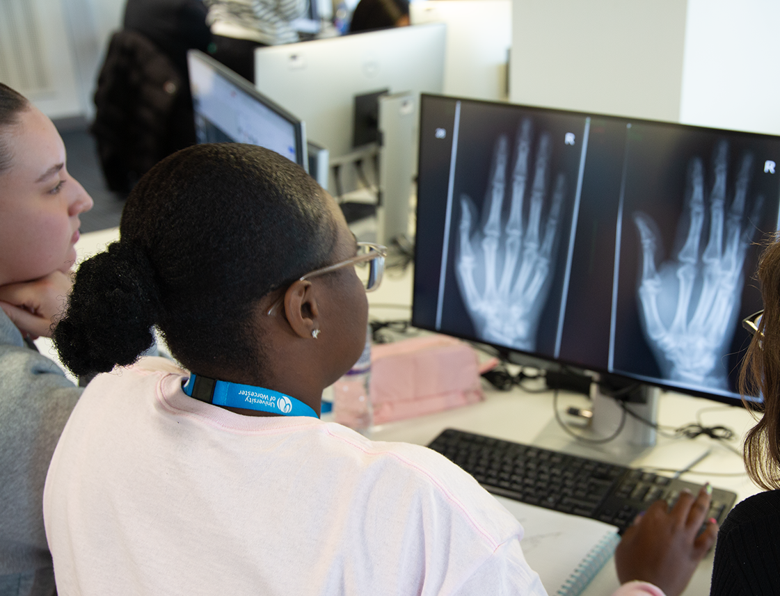 Radiography students and lecturer analysing a scan