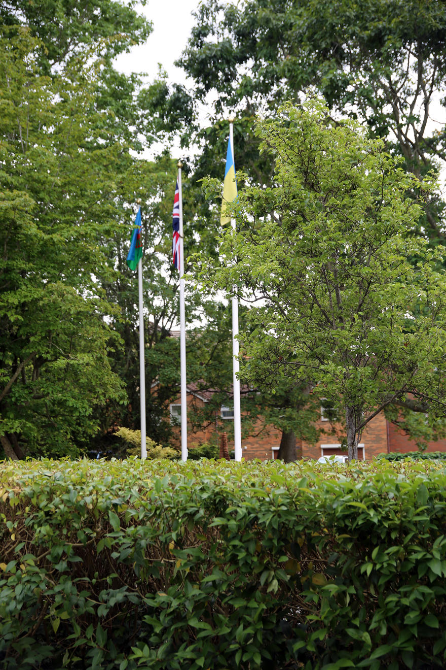 Three flags fly outside the University of Worcester