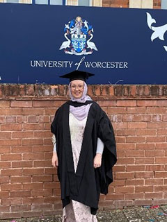 University of Worcester logo on a light blue background