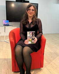 Trudi holding her book