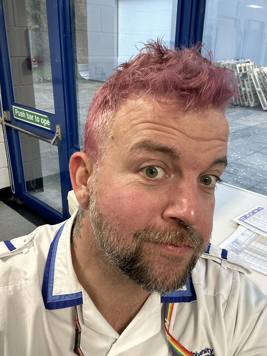 Danny Coleman poses in his nursing uniform