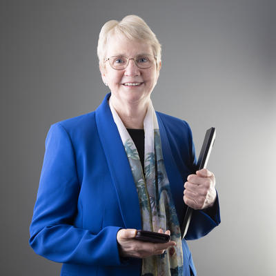 Profile photo of Mary Mahoney smiling in a blue blazer