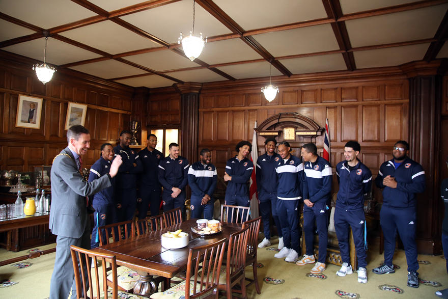 Worcester Wolves laugh together as they talk to the Mayor of Worcester