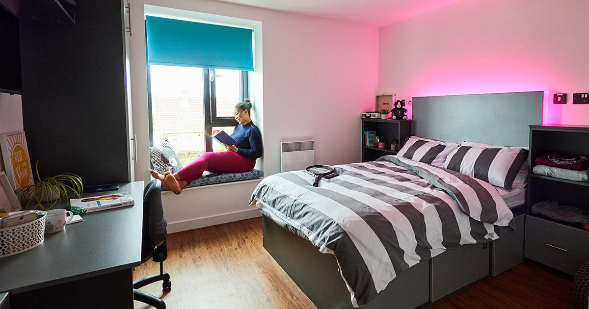 Student in their bedroom in halls