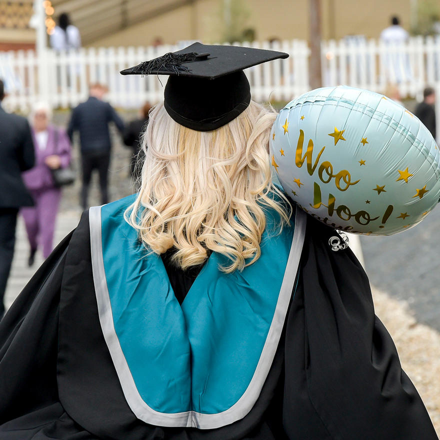 Graduate with balloon