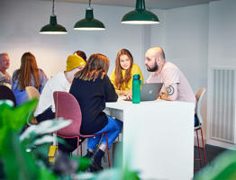 Students sat around a table in the study centre