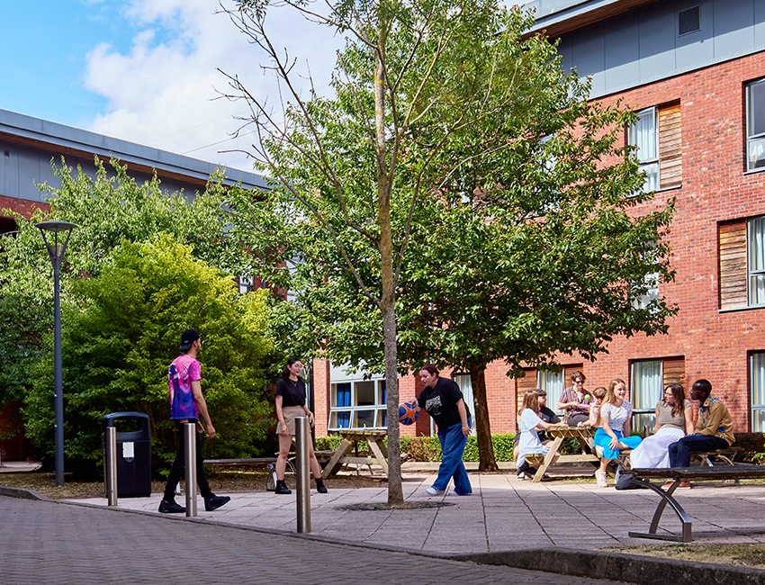 Students socialisng outside accommodation