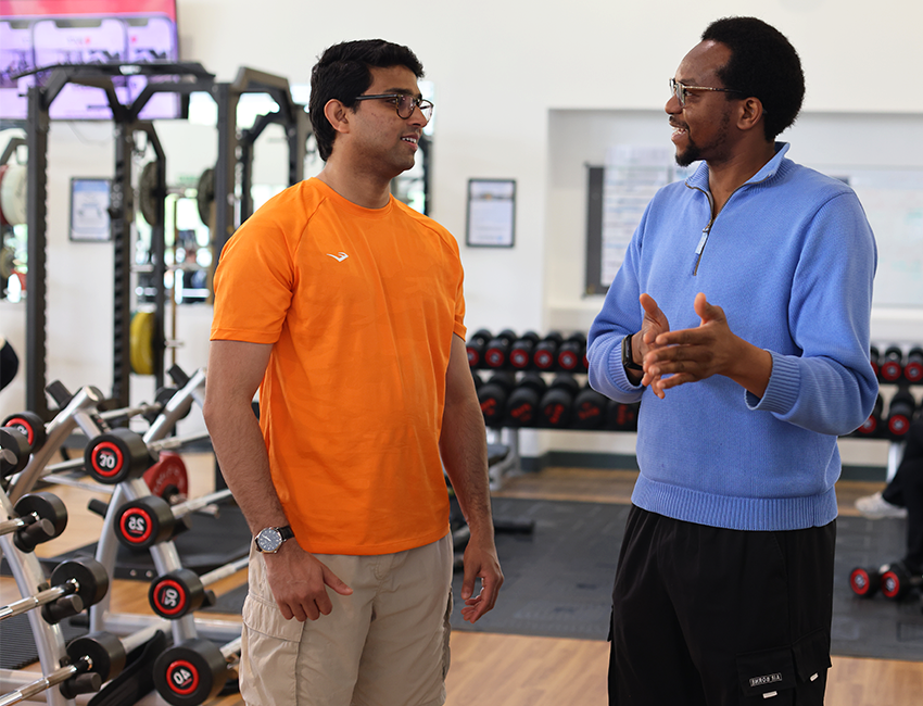 Students talking in the gym