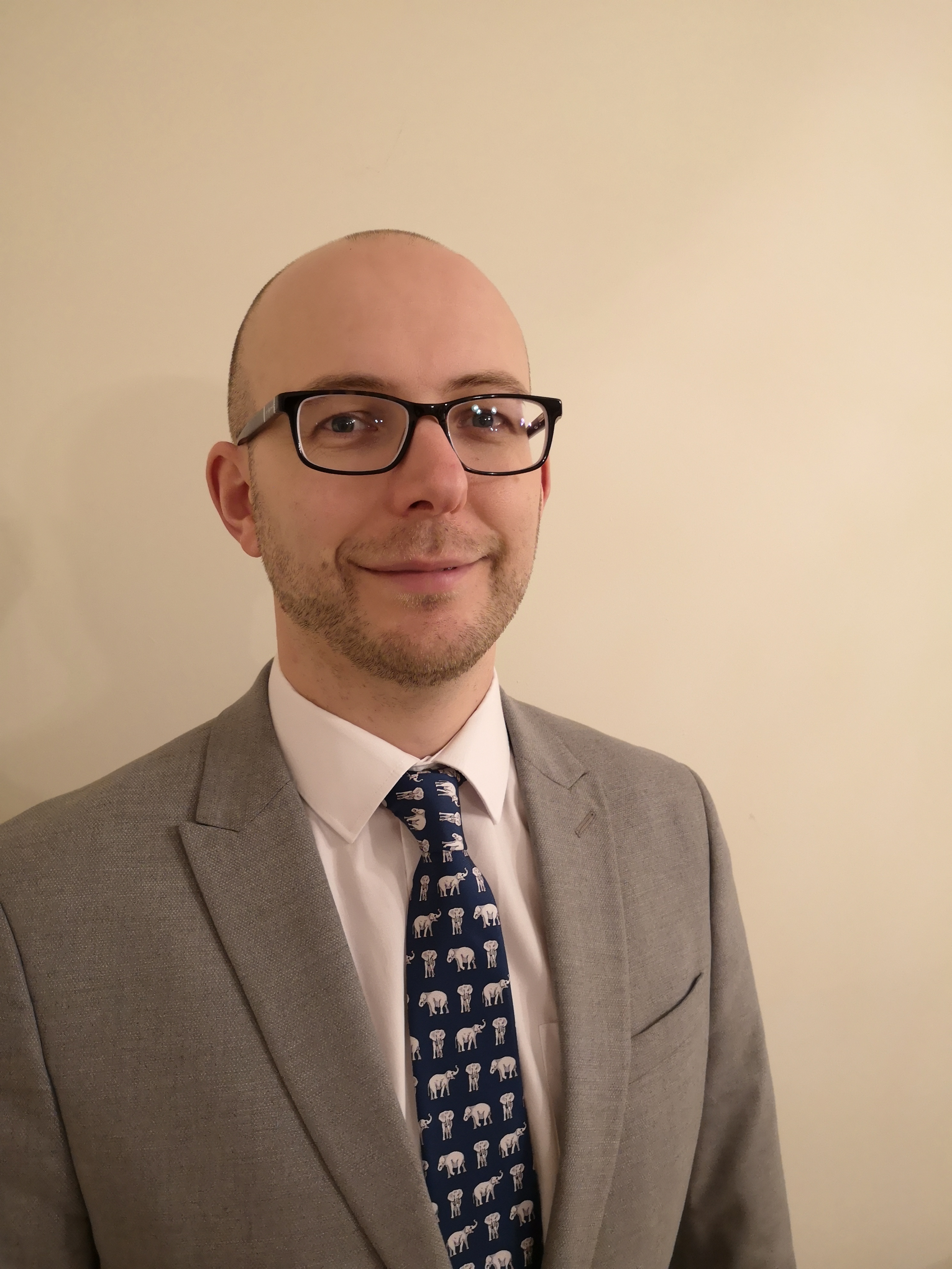 University of Worcester logo on a light blue background