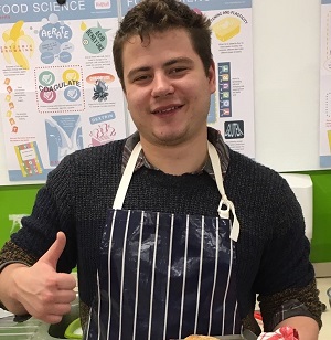 University of Worcester logo on a light blue background