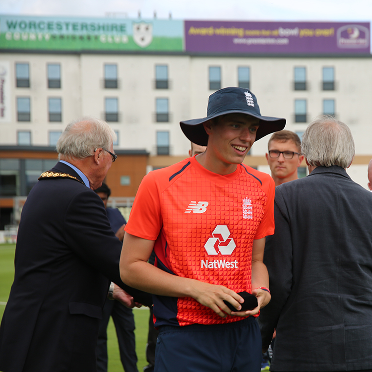 University of Worcester logo on a light blue background