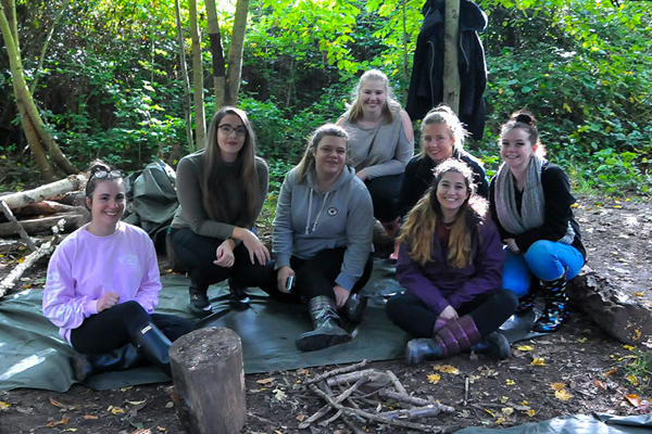 Group of Early Childhood in Society students in a wood