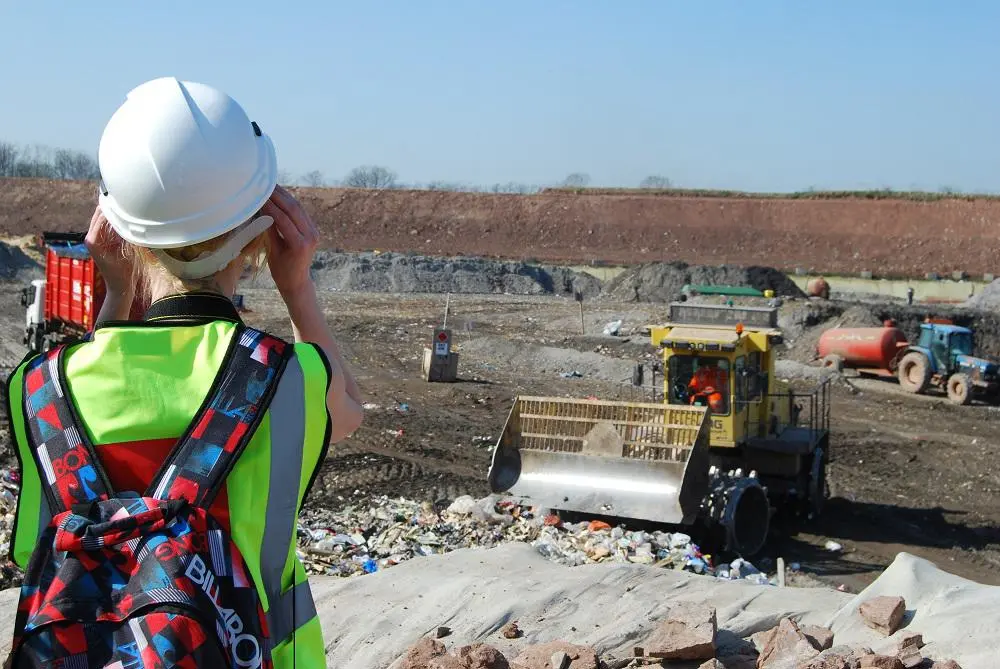 back of student with binoculars