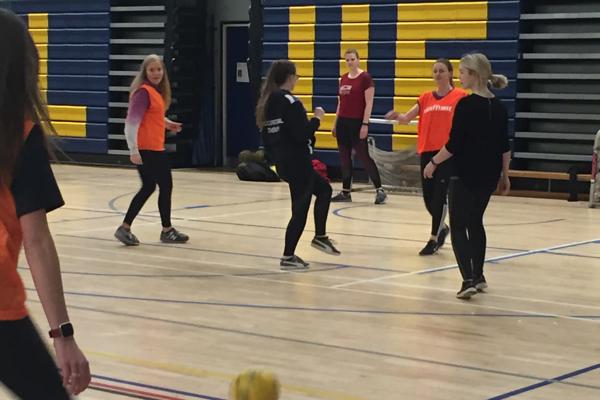 A group of female Occupational Therapy trainees playing football as part of our occupational therapy degree.