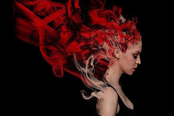 Graphic design degree course student artwork - woman with red hair dissolving into flames