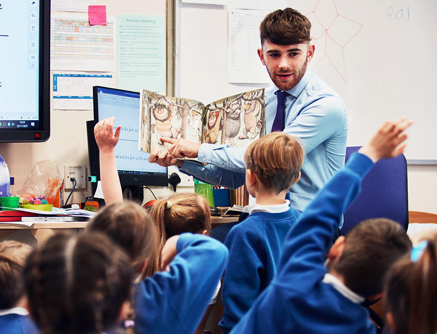 Student teacher reading to class