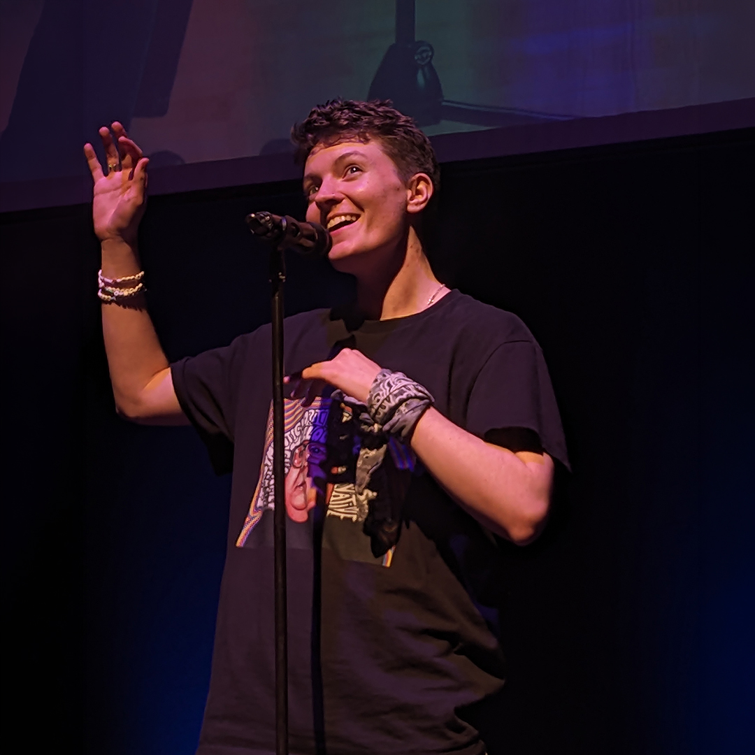 a student performing in front of a mic