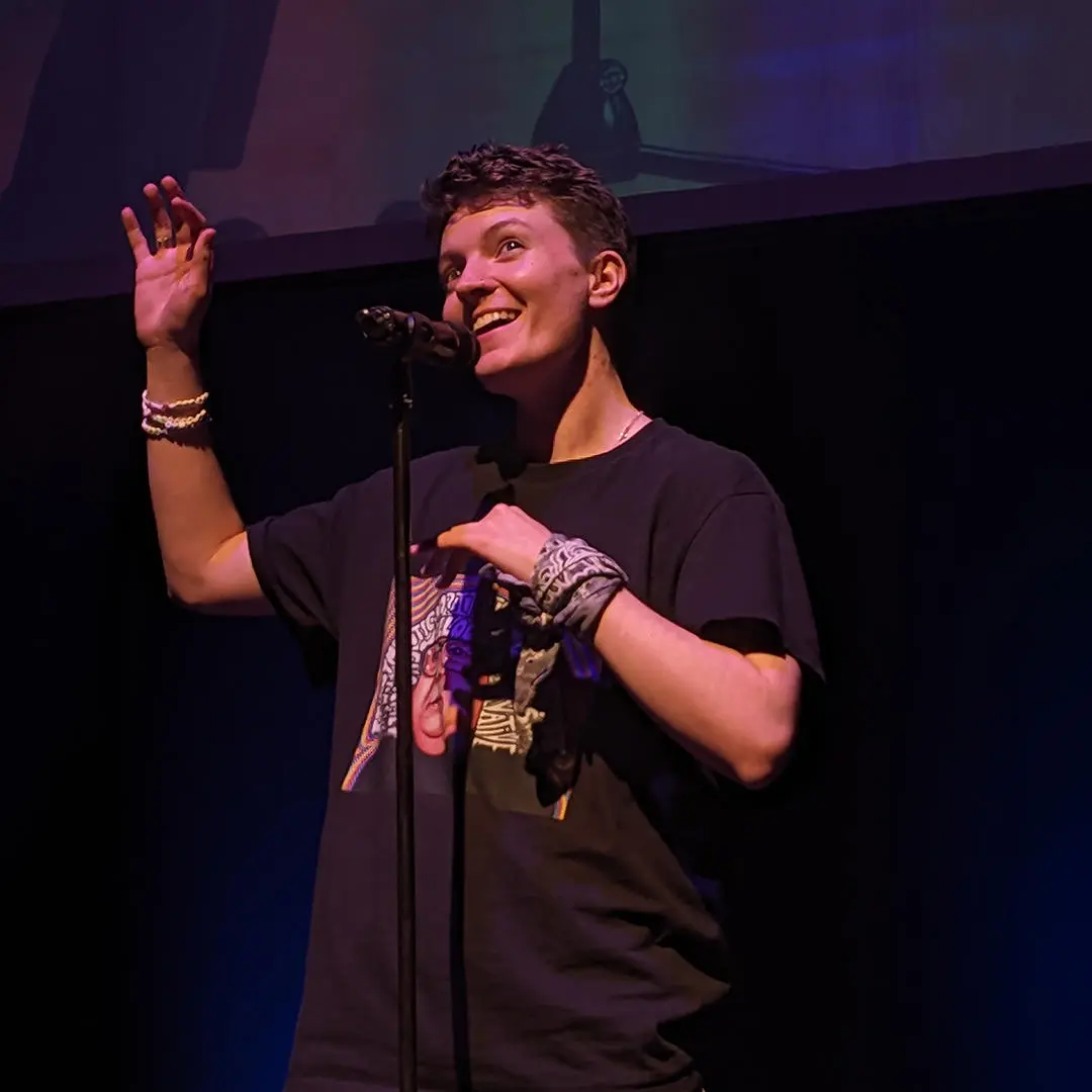 a student performing in front of a mic