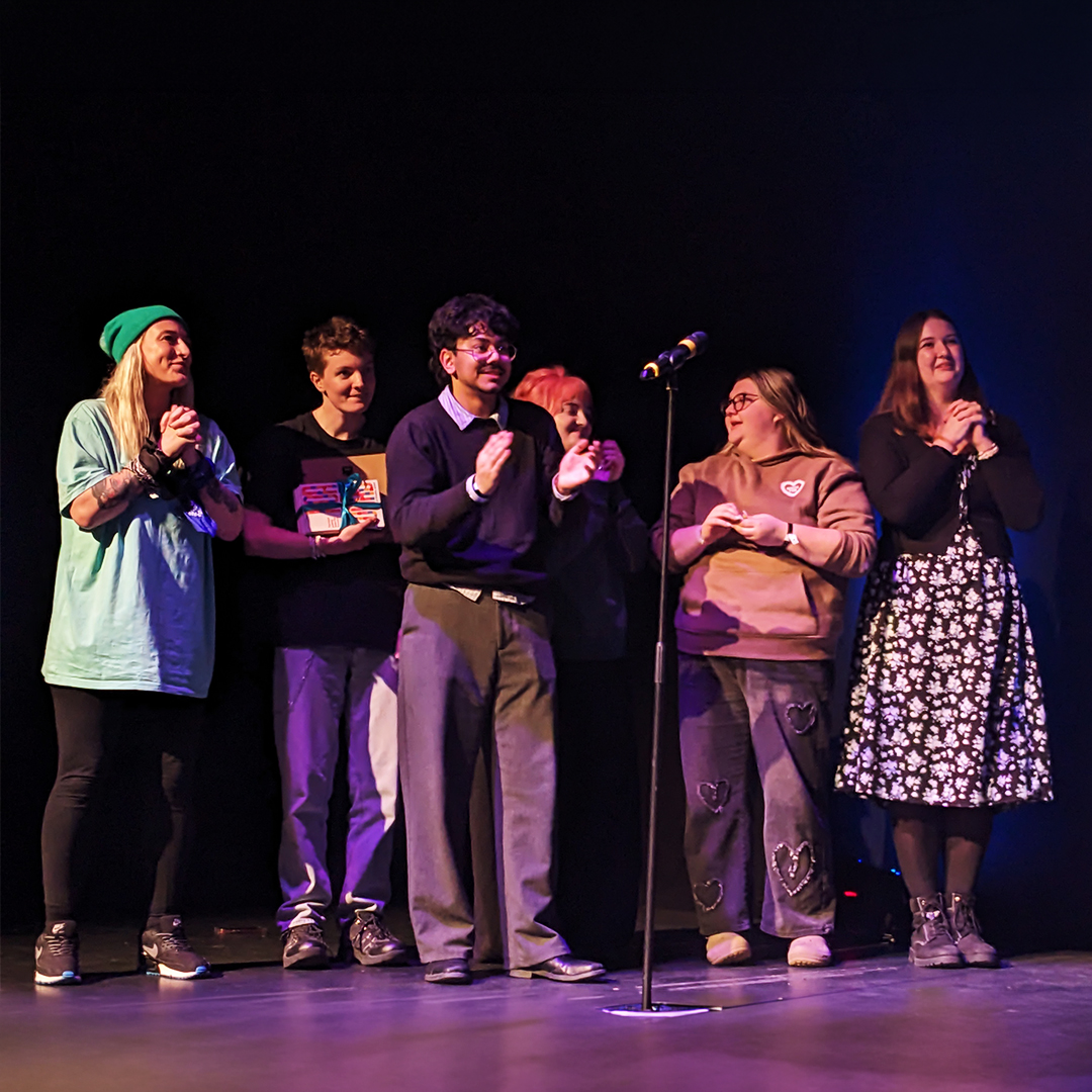 a group of students celebrating a competition win