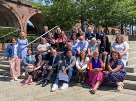 A large group of people outside the Hive library