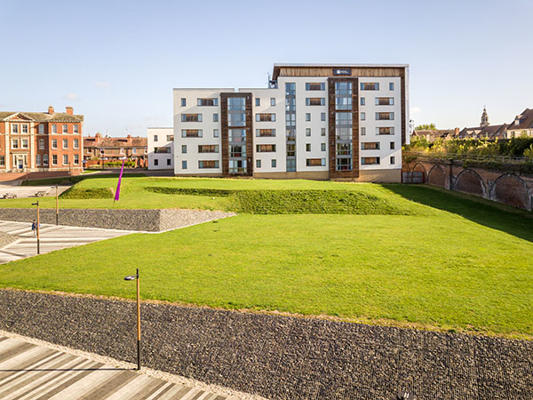 Accommodation building with grass in front