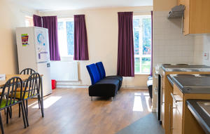 inside a communal kitchen looking towards the window