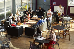 elevated view of students sitting in the communal area in the hangar