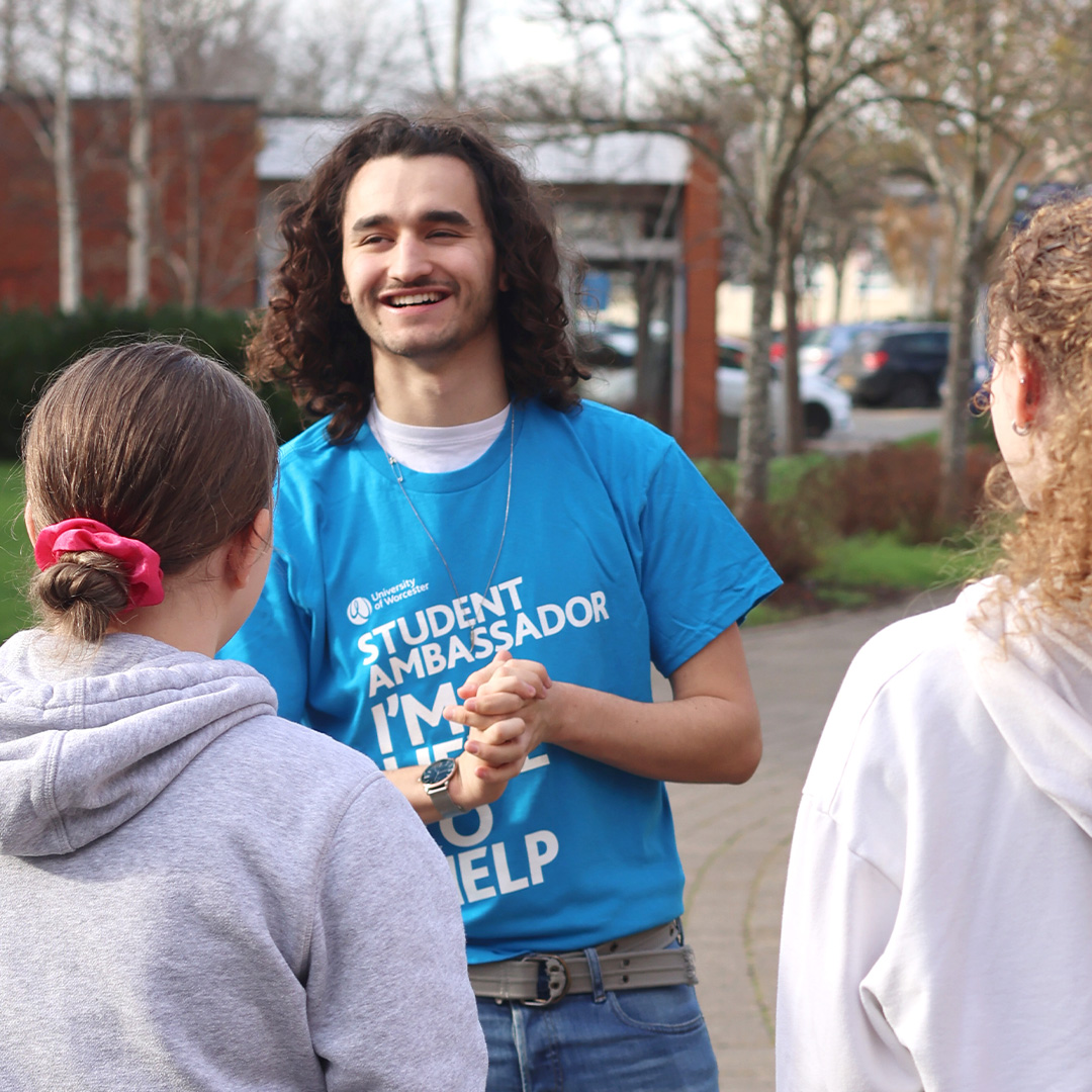 A student ambassador leading a campus tour