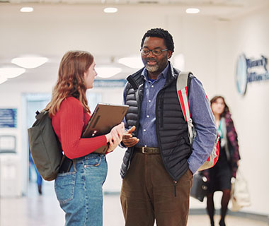 A student is chatting to a lecturer