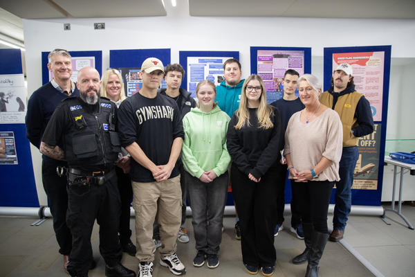 Group of people in front of posters