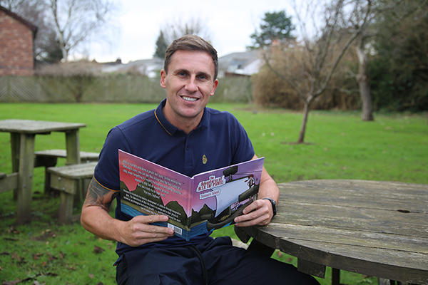 Tom Oldaker with book