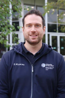 University of Worcester logo on a light blue background