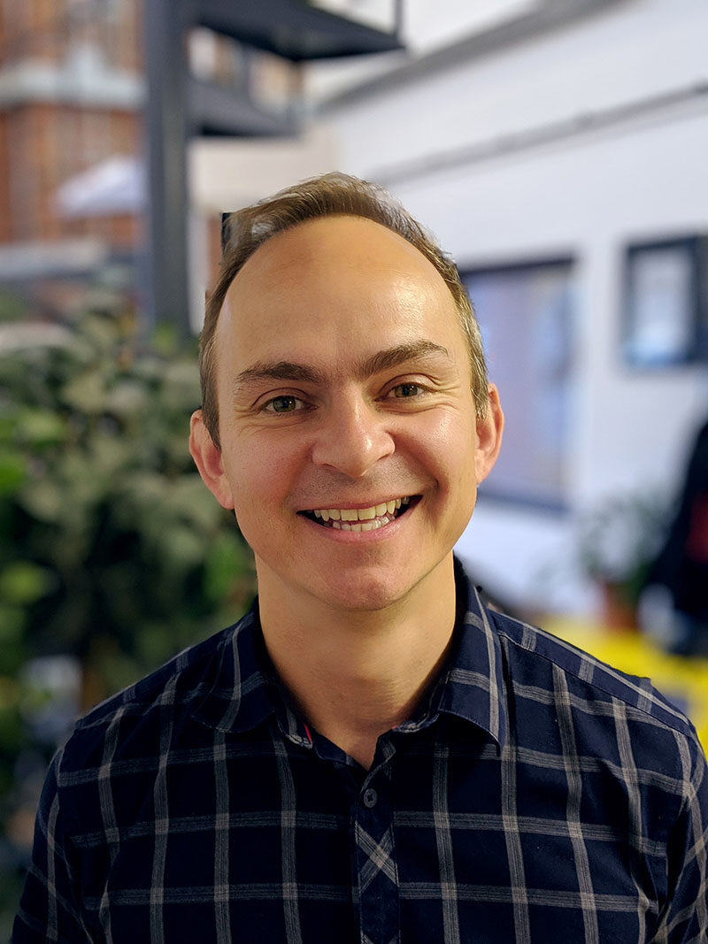 University of Worcester logo on a light blue background