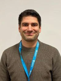 University of Worcester logo on a light blue background