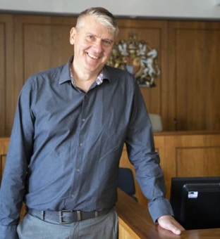 University of Worcester logo on a light blue background