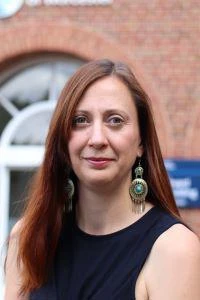 University of Worcester logo on a light blue background